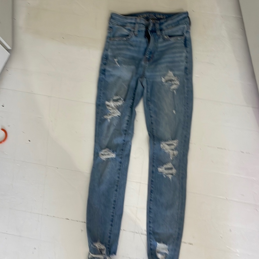 American Eagle blue skinny jeans with holes for cheap extra stretch